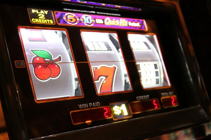 casino slots showing cherries and seven